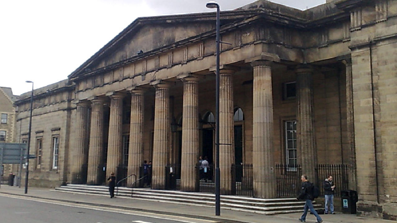 Sheriff reconvenes court in police station room after cells flood