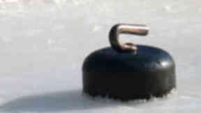 Curling stone: Former champ sues national coach over remarks.
