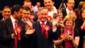 Labour Glasgow City Council leader Gordon Matheson centre celebrates a candidates victory at the Glasgow local elections at the SECC