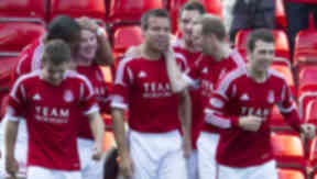 Gavin Rae (centre) celebrates with his team mate's after putting Aberdeen ahead.