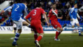 Dave Mackay (left) slots his effort home to break the deadlock for St Johnstone