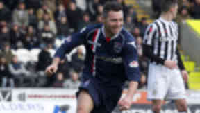 Ross County's Ivan Sproule wheels away to celebrate his second goal.