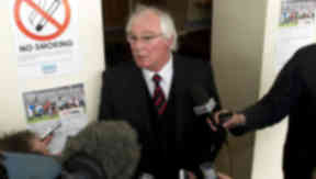 Dunfermline's Director of Football Jim Leishman (centre) announces to the press that the club will apply for administration.