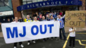 Young Kilmarnock supporter Sean Dean (right) backs now former manager Kenny Shiels. Rugby Park protest on June 11 2013
