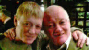 John (right) pictured with his son.