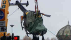 Accident: The helicopter being removed from the site.