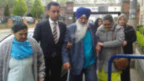 Surjit Singh Chhokar family of murdered waiter with solicitor Amer Anwar on way to meeting with Lord Advocate. Pic from Broadcast.