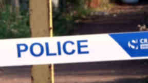 Death: Police set up a cordon around the property.