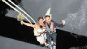 Groom Ross Basham from North London and bride Hannah Phillips from Suffolk after their bungee jump wedding.