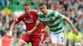 Celtic's Jozo Simunovic (right) battles with Adam Rooney