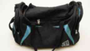 Sports bag: The culprit used this blue holdall during the robbery.
