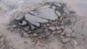Pothole: Scotland's roads are facing a backlog of work.