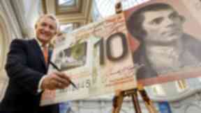David Duffy: Clydesdale Bank chief executive signs the first of the new notes.
