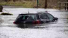 Water: Cars were left submerged earlier this week.
