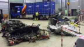 Wreckage: Investigators examine remains of helicopter.