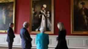 The Queen admires the new portrait.