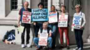 Named Person: Protesters outside the Supreme Court on Thursday.