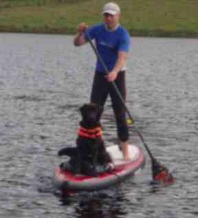 Dean with his dog Stumpy at the helm.