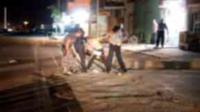Four men grappled with the boy