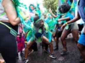 Revellers dance in the street