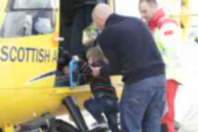 Milo and his dad explore the helicopter.