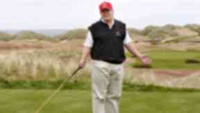 Donald Trump: US president playing a hole at his Aberdeenshire course.