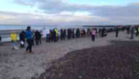 Protest: They gethered on a beach.