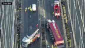 Crash: Engineers working at the site on Wednesday morning.