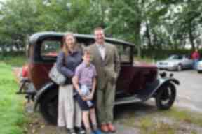 Robin Wills and his family with the Humber they restored.
