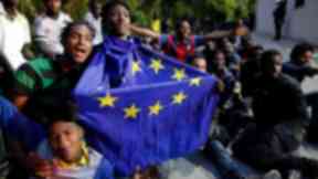 Migrants celebrate after entering Ceuta.