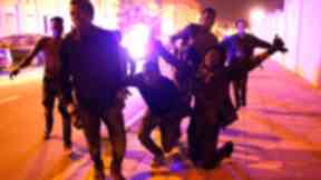 Migrants celebrate after entering Ceuta.