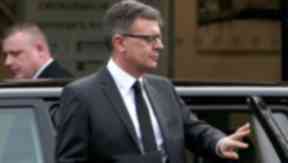 David Logan: Father at son's funeral service.