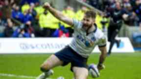 Scotland's Tommy Seymour celebrates scoring his side's fourth try.