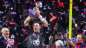 Tom Brady wore a champions t-shirt as he collected the Super Bowl prize.