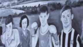 An image of Ryan McBride, right, features on a Derry City mural in Brandywell.