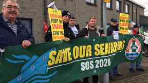 Protest: Cargo ship crew 'paid £2.56 an hour'.