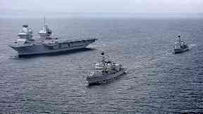 HMS Queen Elizabeth: Carrier undergoing sea trials.