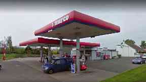 Petrol station: Staff threatened with weapons by robbers.