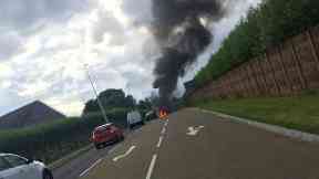 Blaze: Road was closed off while debris and fuel was cleared off.