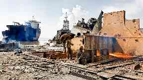 Chittagong: Worker seeks shade under umbrella at the Bhatiary Yard.