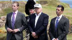 Family affair: Trump and sons during visit to Scotland.