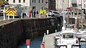 Banff harbour: Concerned onlookers watched on following the crash.