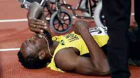 Usain Bolt pulled up with an injury at the last major race of his career.