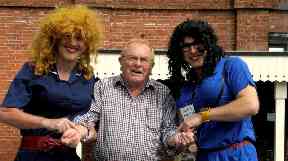 Members of the bed push take a patient's pulse