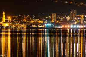 Lights dance on the water.