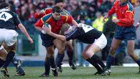 Tackle: Weir in action for Scotland.