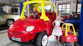 Geof Bitmead and his granddaughter Lili with the largest crazy coupe.