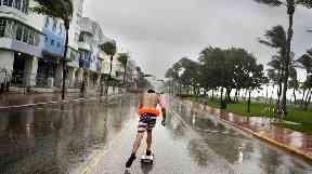 A skateboarder braves the rains in Florida as Irma makes her presence known.