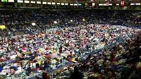 Evacuees fill Germain Arena, which is being used as a fallout shelter.