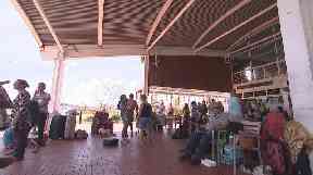 People take shelter at the airport on Beef Island after Hurricane Irma.
